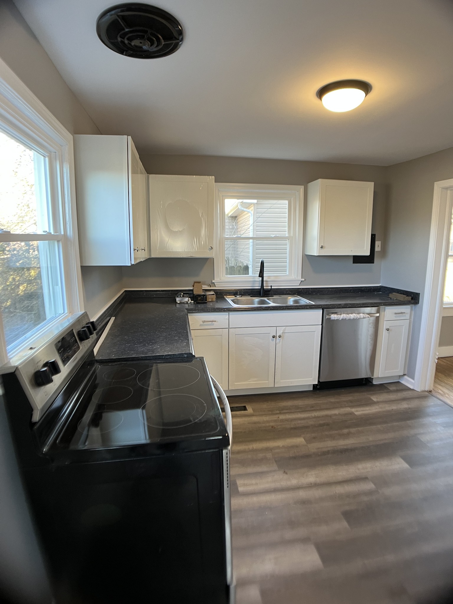 124 Arnold Lane Murfreesboro, TN 37127 - Photo 6 of 14 a kitchen with a sink a stove and cabinets