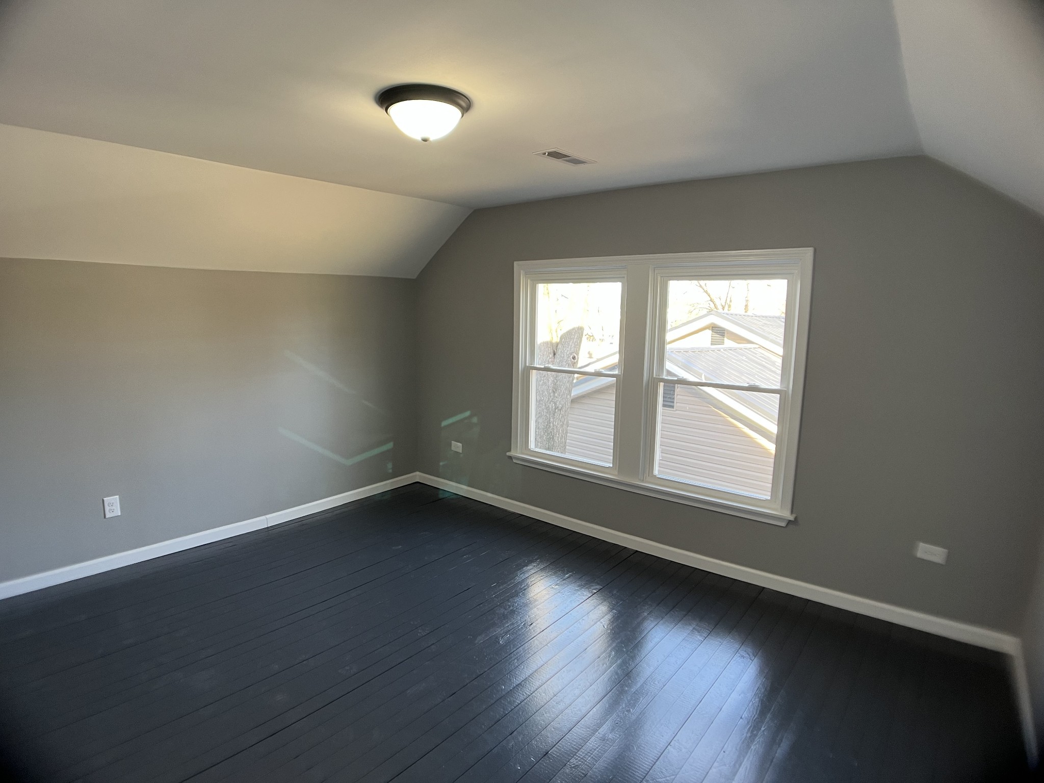 124 Arnold Lane Murfreesboro, TN 37127 - Photo 9 of 14 an empty room with wooden floor and windows
