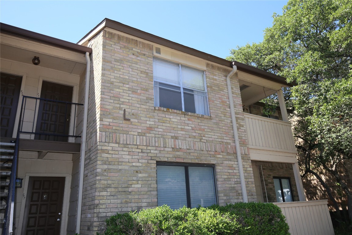 8210 Bent Tree Road, Unit 257 Austin, TX 78759 - Photo 1 of 20 a front view of a house with garage