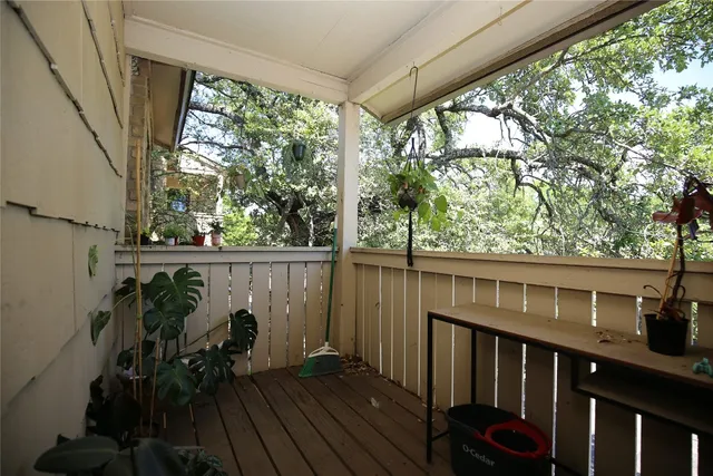 a view of balcony with furniture and wooden deck