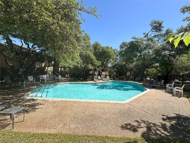 a view of a playground with basketball court