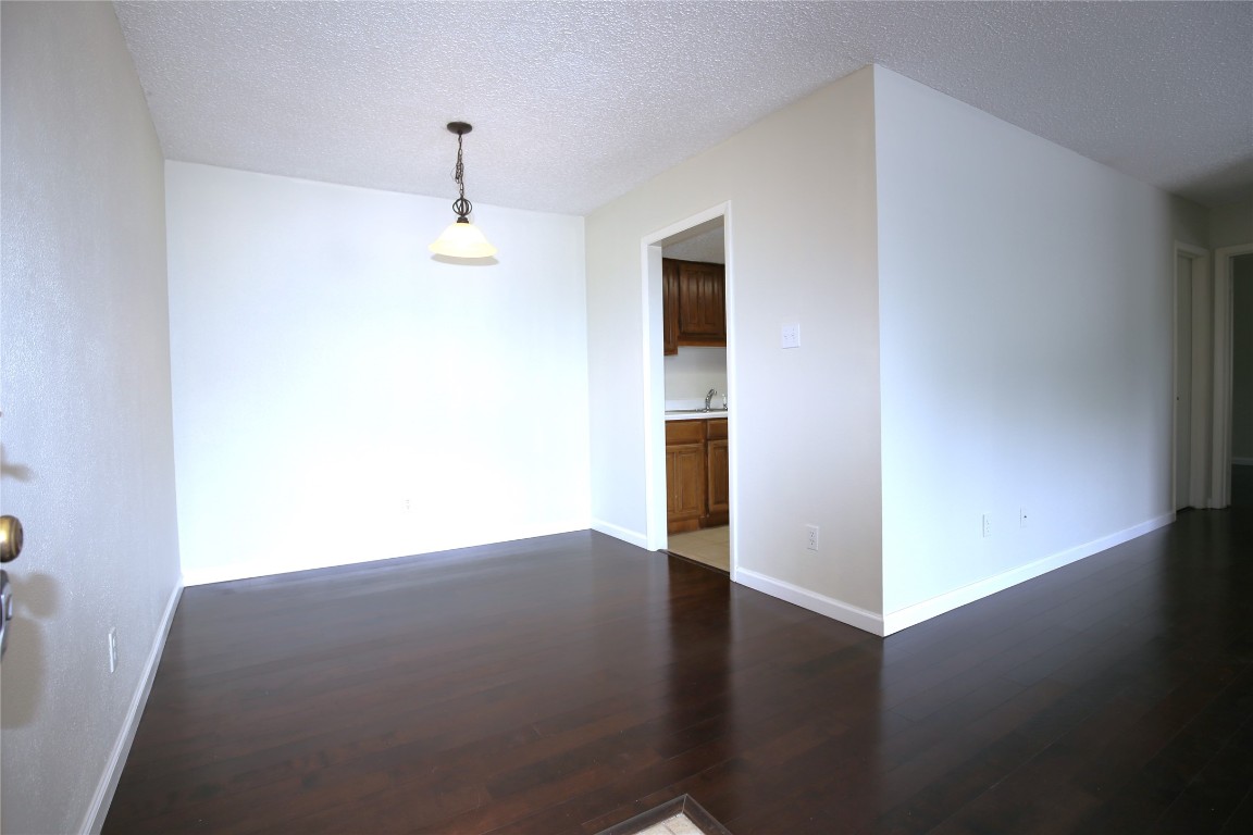 8210 Bent Tree Road, Unit 257 Austin, TX 78759 - Photo 3 of 20 a view of a hallway with wooden floor
