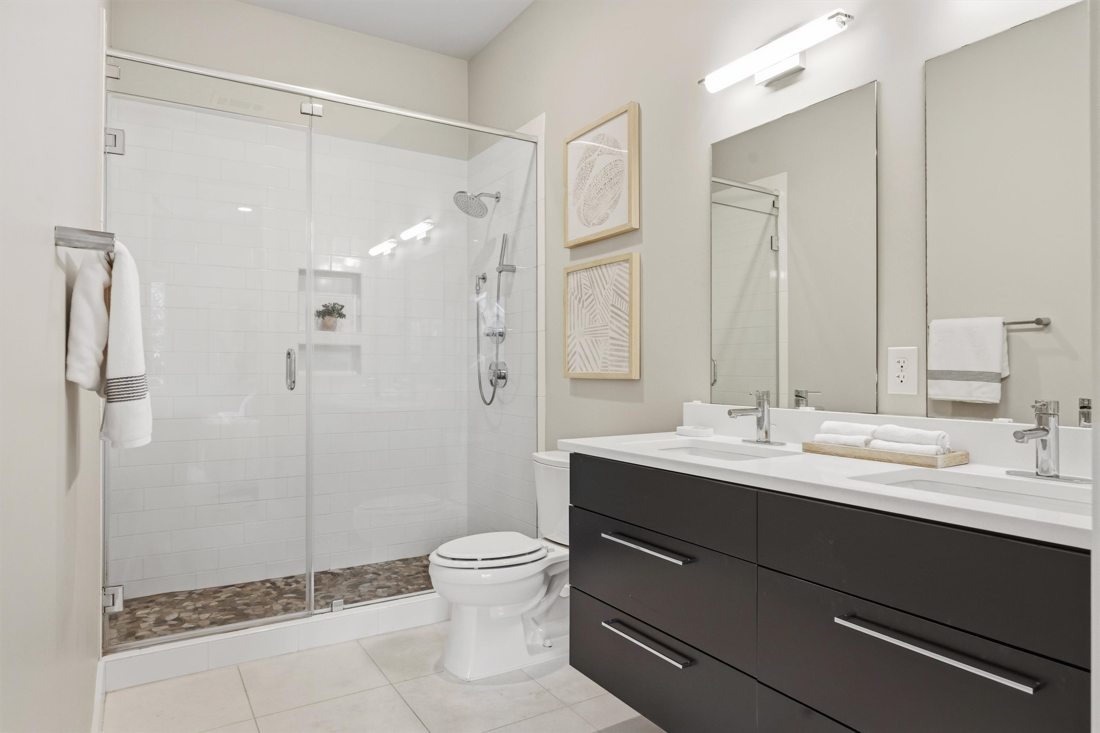 2314 Enfield Road, Unit 203 Austin, TX 78703 - Photo 20 of 37 Double vanity with quartz countertops and sleek espresso cabinetry — form meets function.