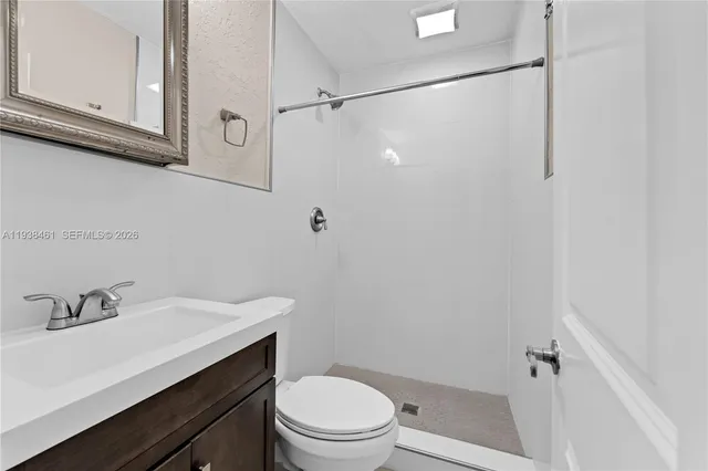 a kitchen with stainless steel appliances granite countertop a sink and a stove