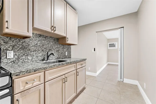 a kitchen with stainless steel appliances granite countertop a stove and a refrigerator