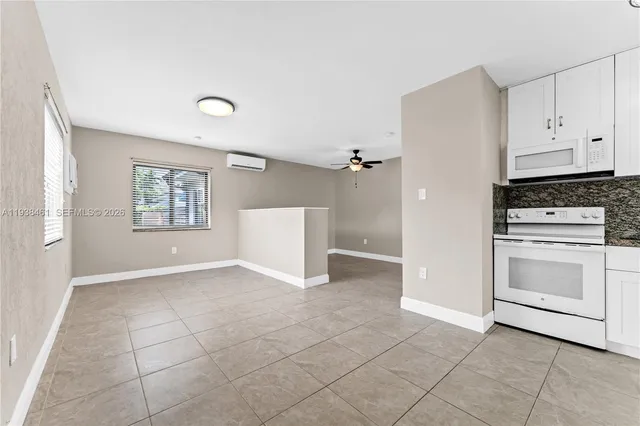 a view of room with window and ceiling fan
