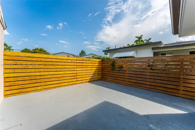 a kitchen with a refrigerator and a sink