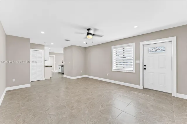 an aerial view of multiple houses with yard