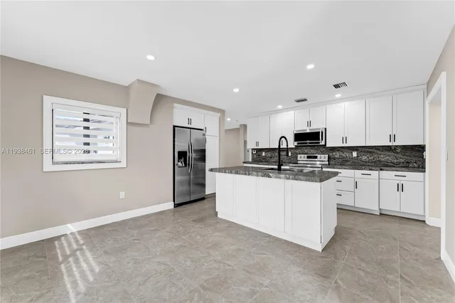 an aerial view of a house with a garden