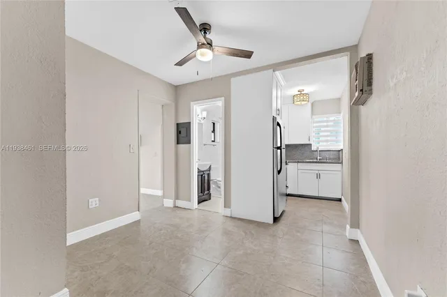 a view of a kitchen with a sink and dishwasher