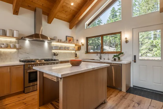 a kitchen with a stove and a sink