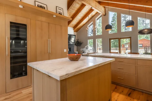 a kitchen with a sink a counter top space and stainless steel appliances