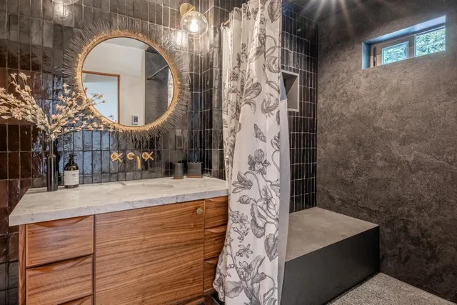 a bathroom with a sink and a mirror