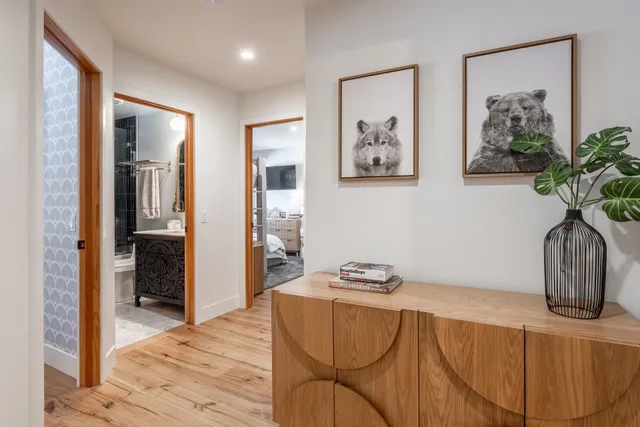 a bedroom with furniture and wooden floor