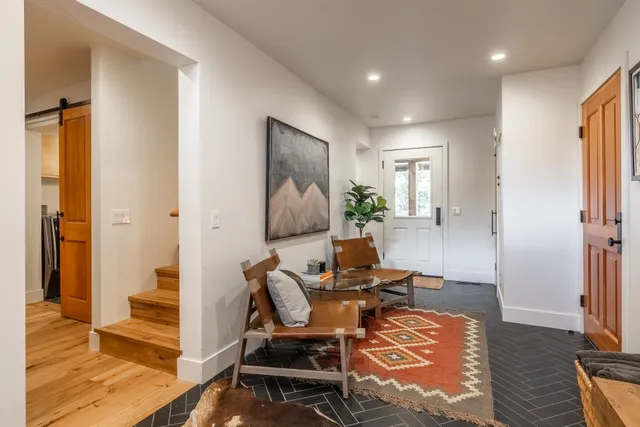a workspace with furniture and wooden floor