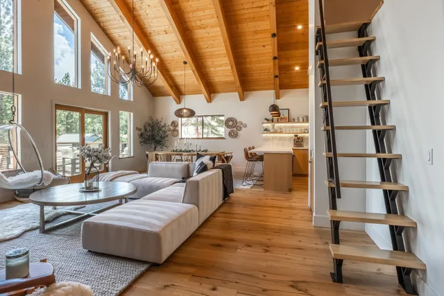 a living room with furniture and a book shelf