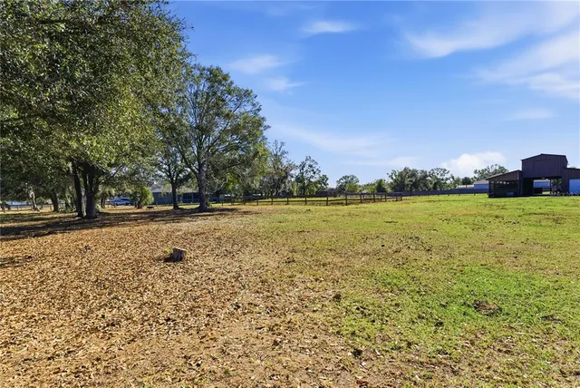 a view of a swimming pool and an outdoor seating