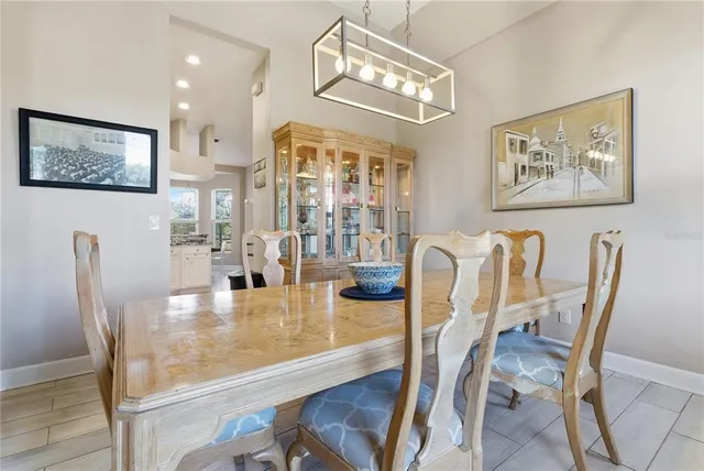 a kitchen with granite countertop a refrigerator stove and sink