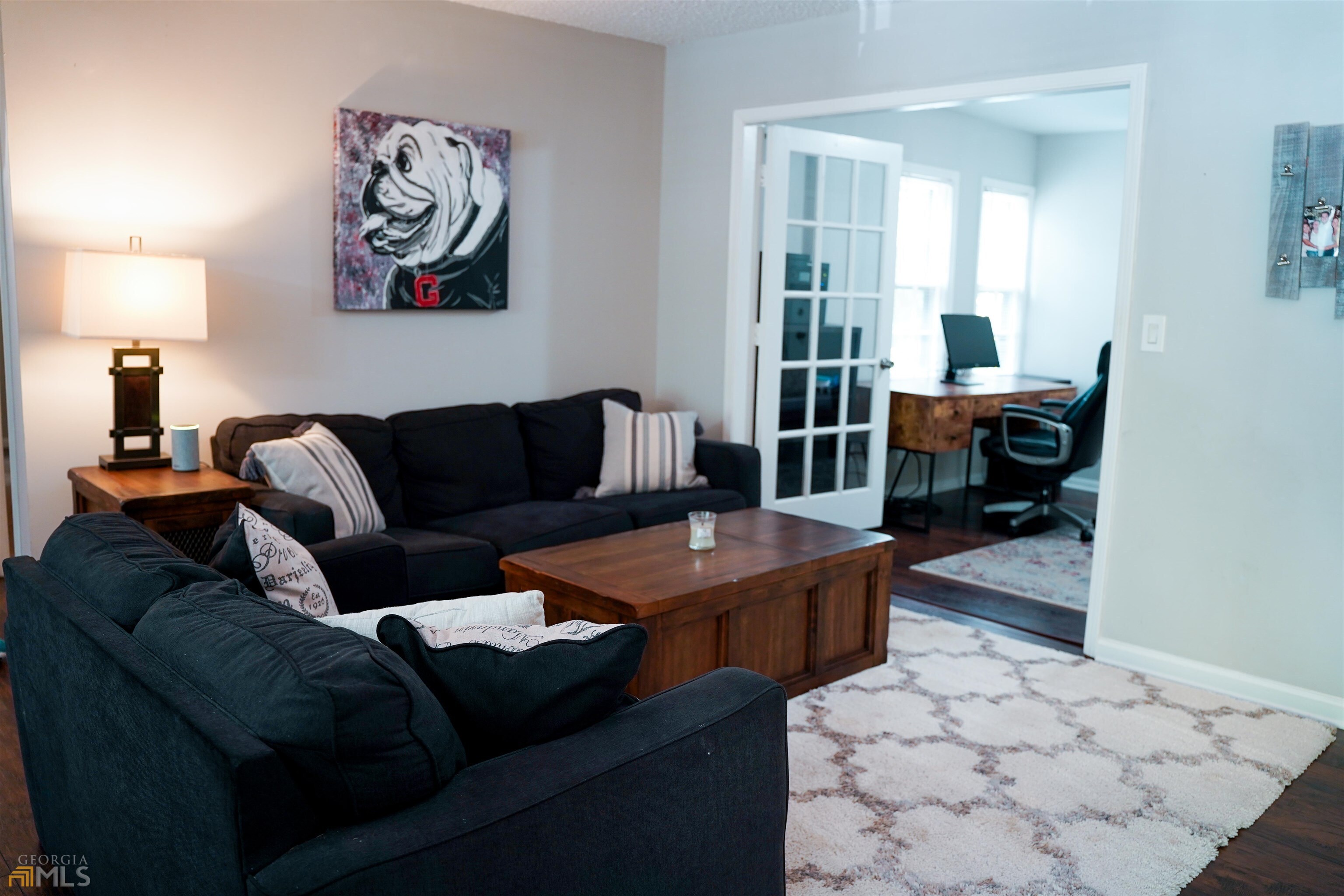 a living room with furniture and a table