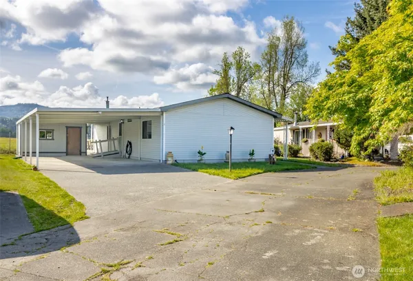 a view of house with yard and entertaining space