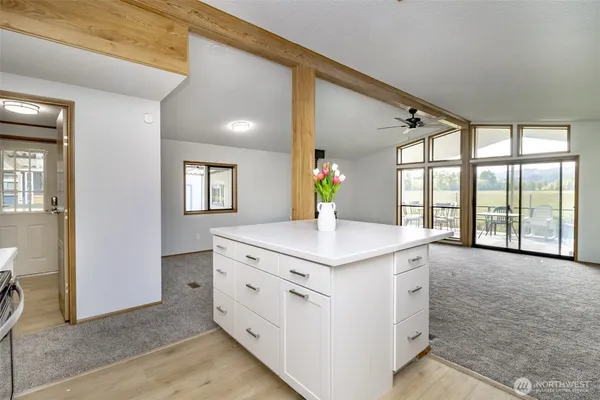 a kitchen with a stove and a white cabinets