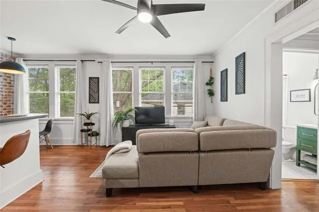 a living room with furniture and windows