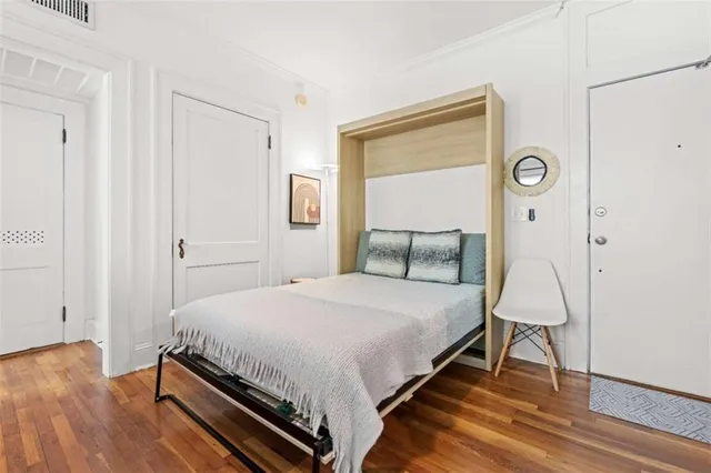 a bedroom with a bed and a table