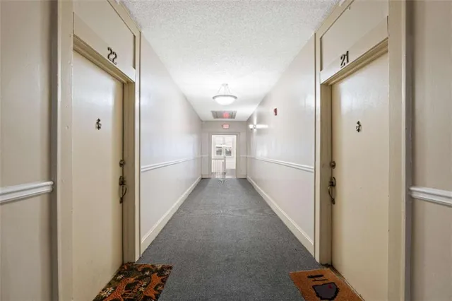 a view of a hallway view with staircase