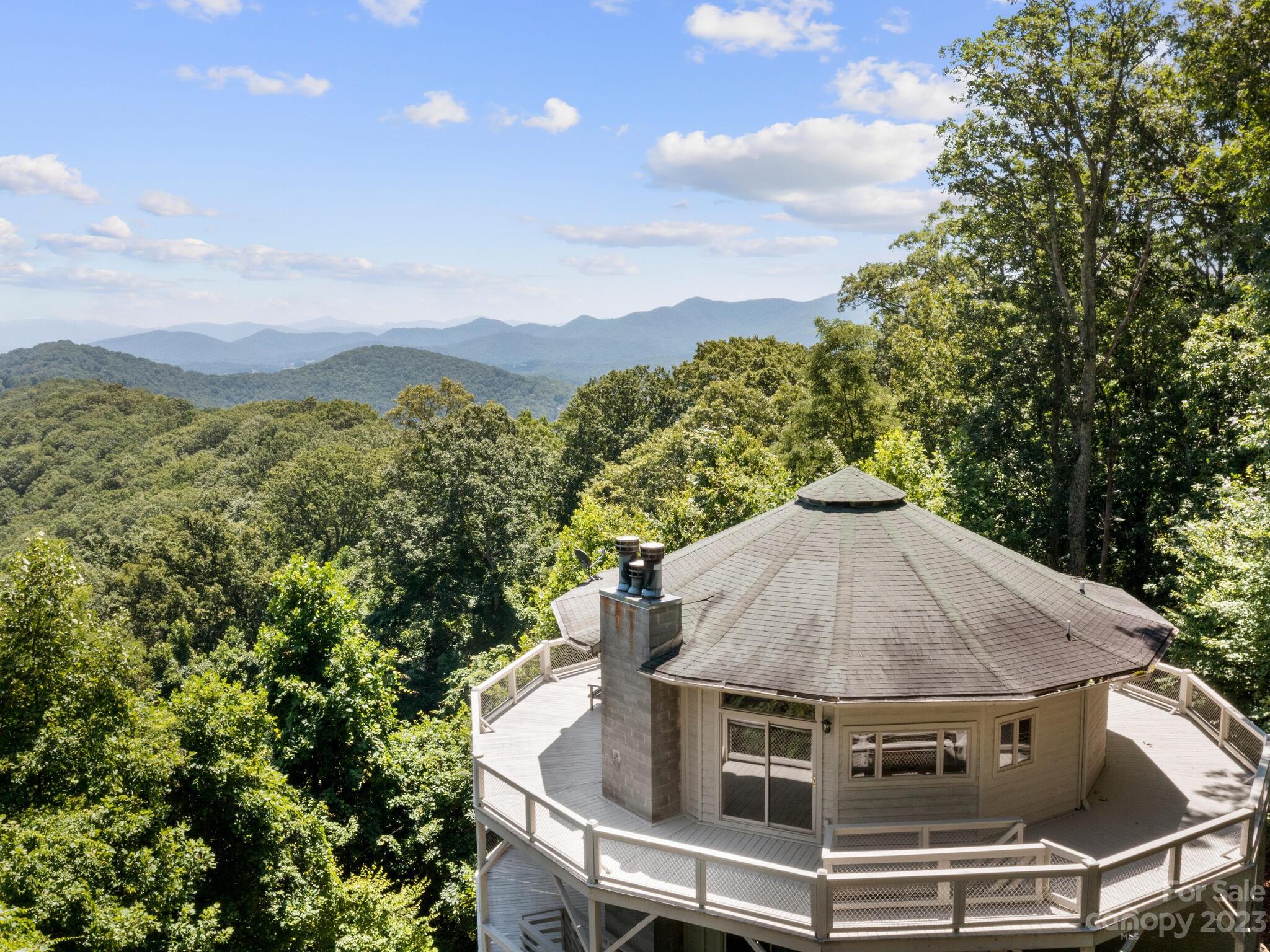 39 Rising Sun Road Candler, NC 28715 - Photo 11 of 41 a view of a house with a yard fire pit and outdoor seating