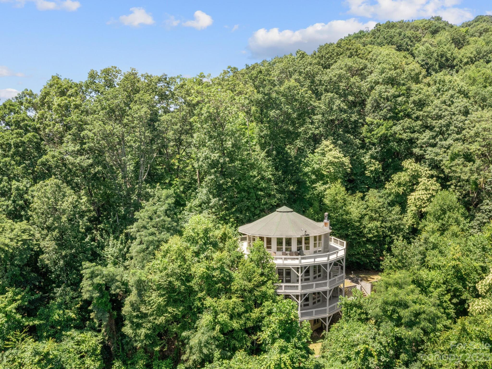 39 Rising Sun Road Candler, NC 28715 - Photo 13 of 41 a front view of a house with a yard
