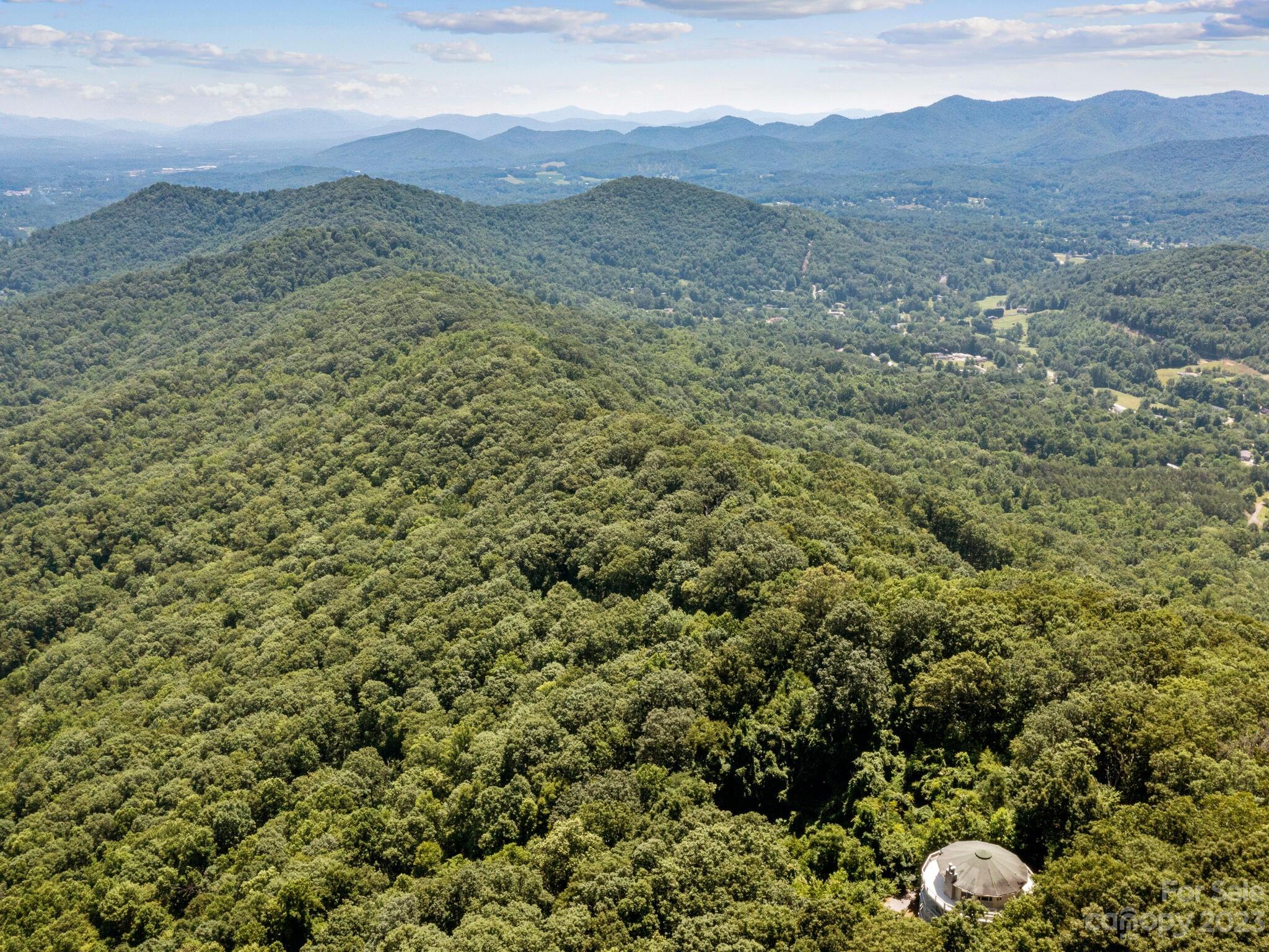 39 Rising Sun Road Candler, NC 28715 - Photo 15 of 41 a view of a mountain range with lush green forest