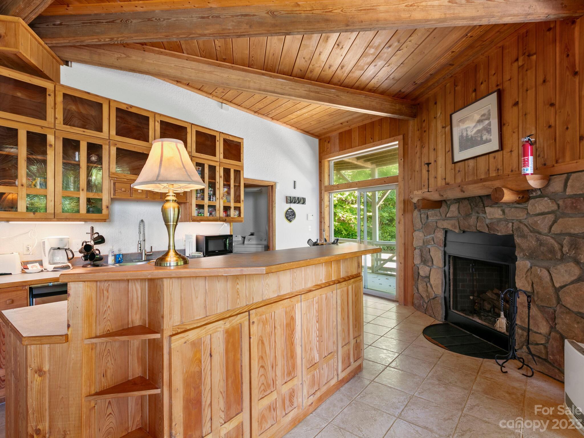 39 Rising Sun Road Candler, NC 28715 - Photo 21 of 41 a living room with furniture a fireplace and windows