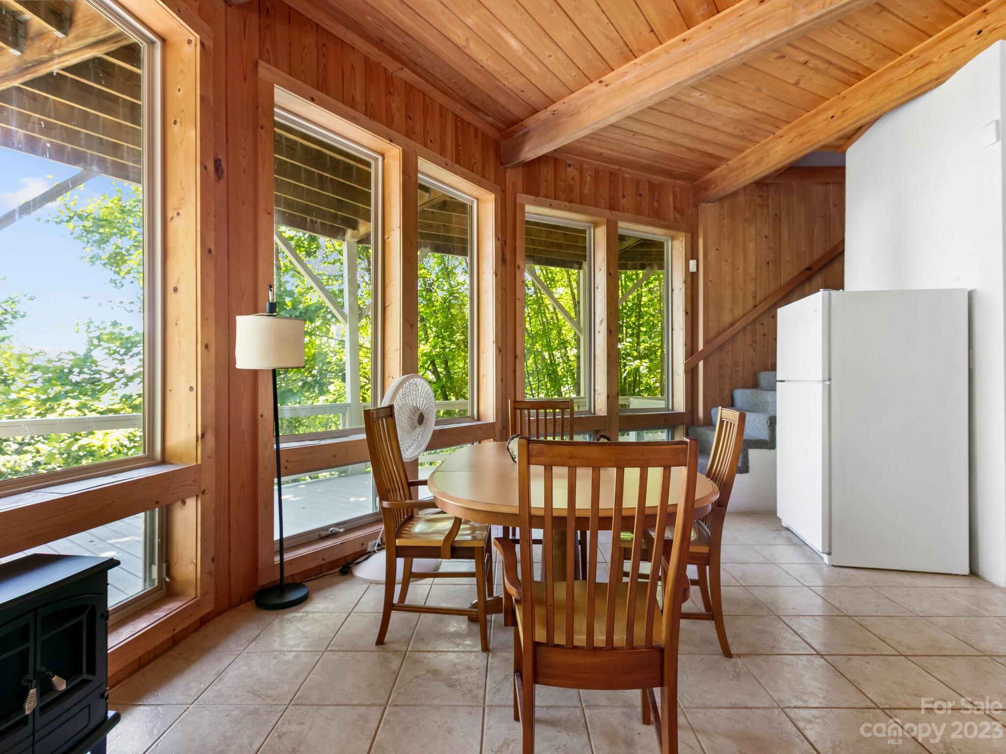 39 Rising Sun Road Candler, NC 28715 - Photo 22 of 41 a view of a dining room with furniture window and outside view