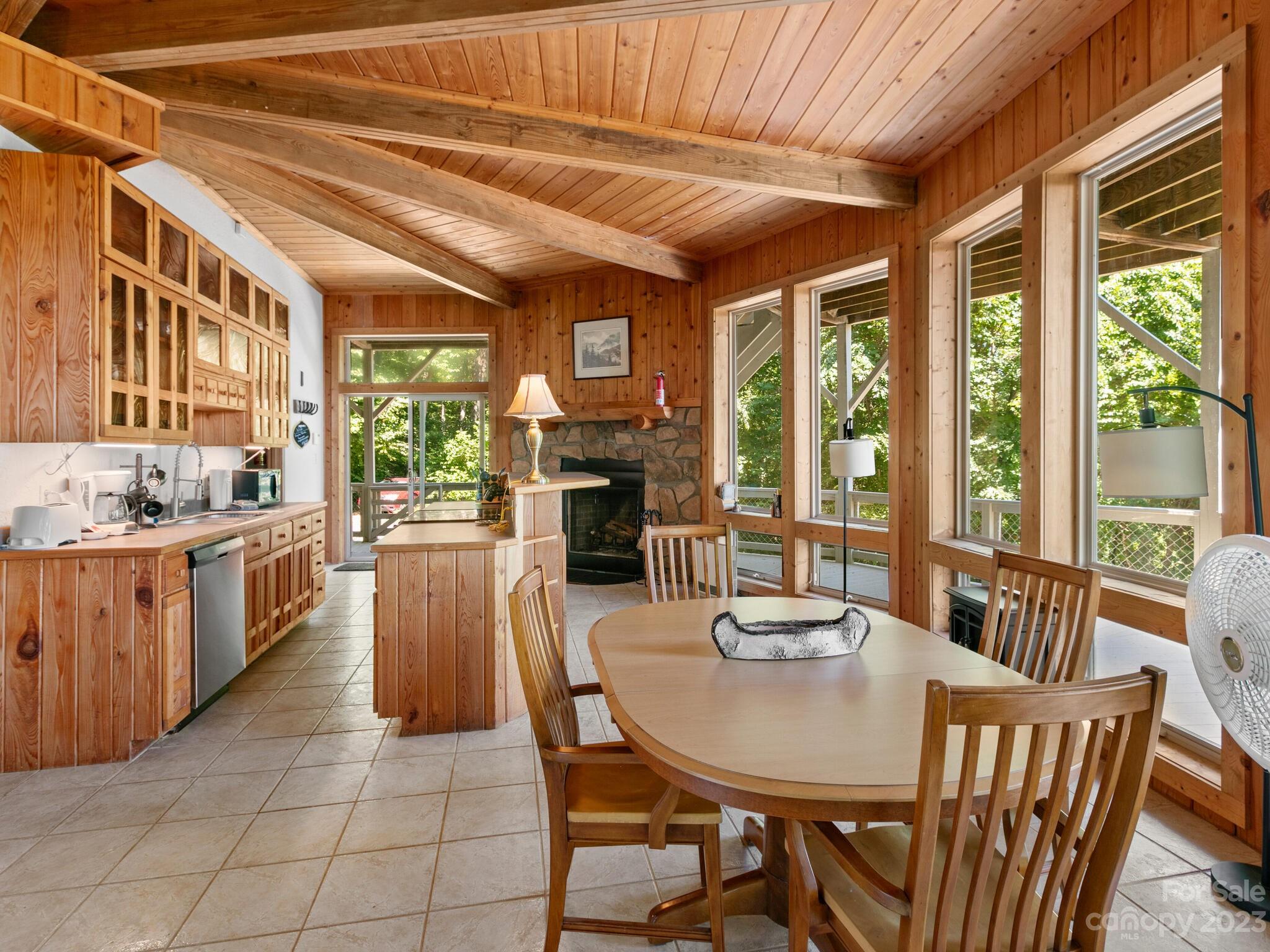 39 Rising Sun Road Candler, NC 28715 - Photo 23 of 41 a view of a dining room with furniture window and outside view