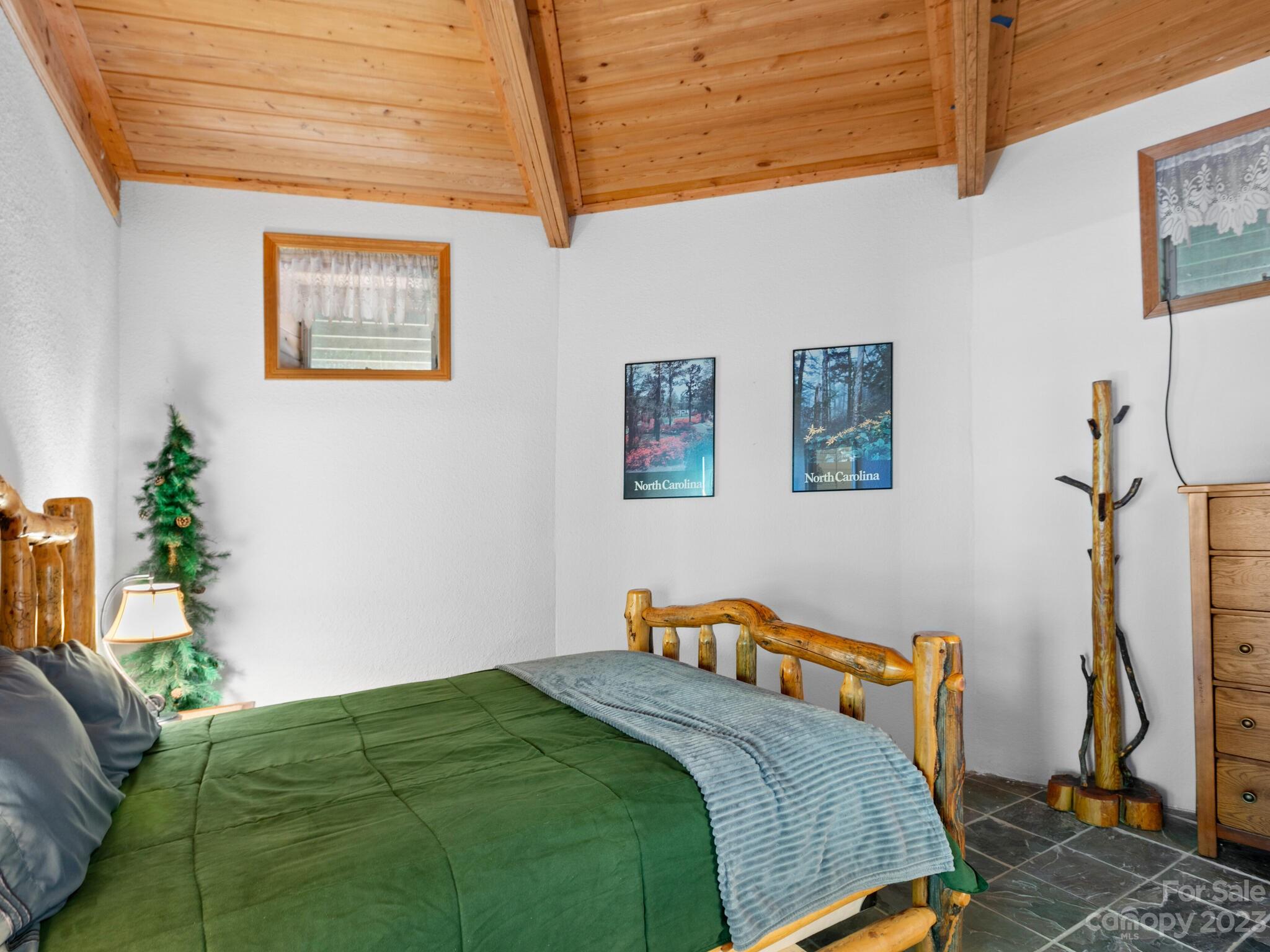 39 Rising Sun Road Candler, NC 28715 - Photo 24 of 41 a bedroom with bed and a window