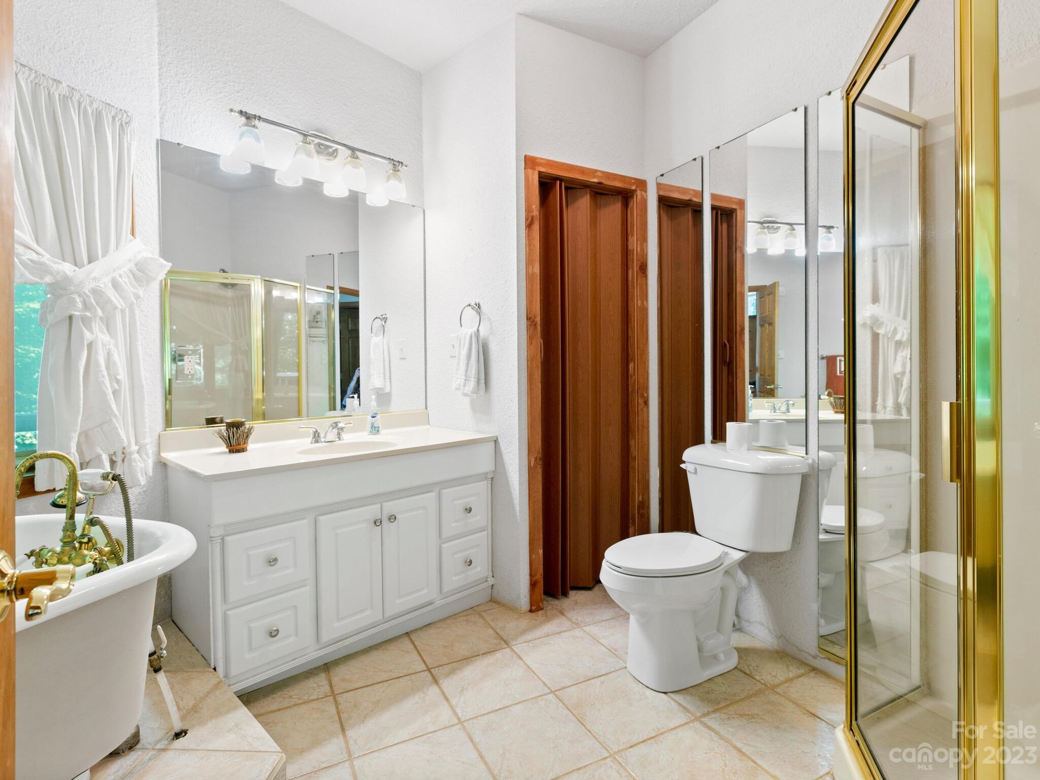 39 Rising Sun Road Candler, NC 28715 - Photo 26 of 41 a bathroom with a sink toilet and shower