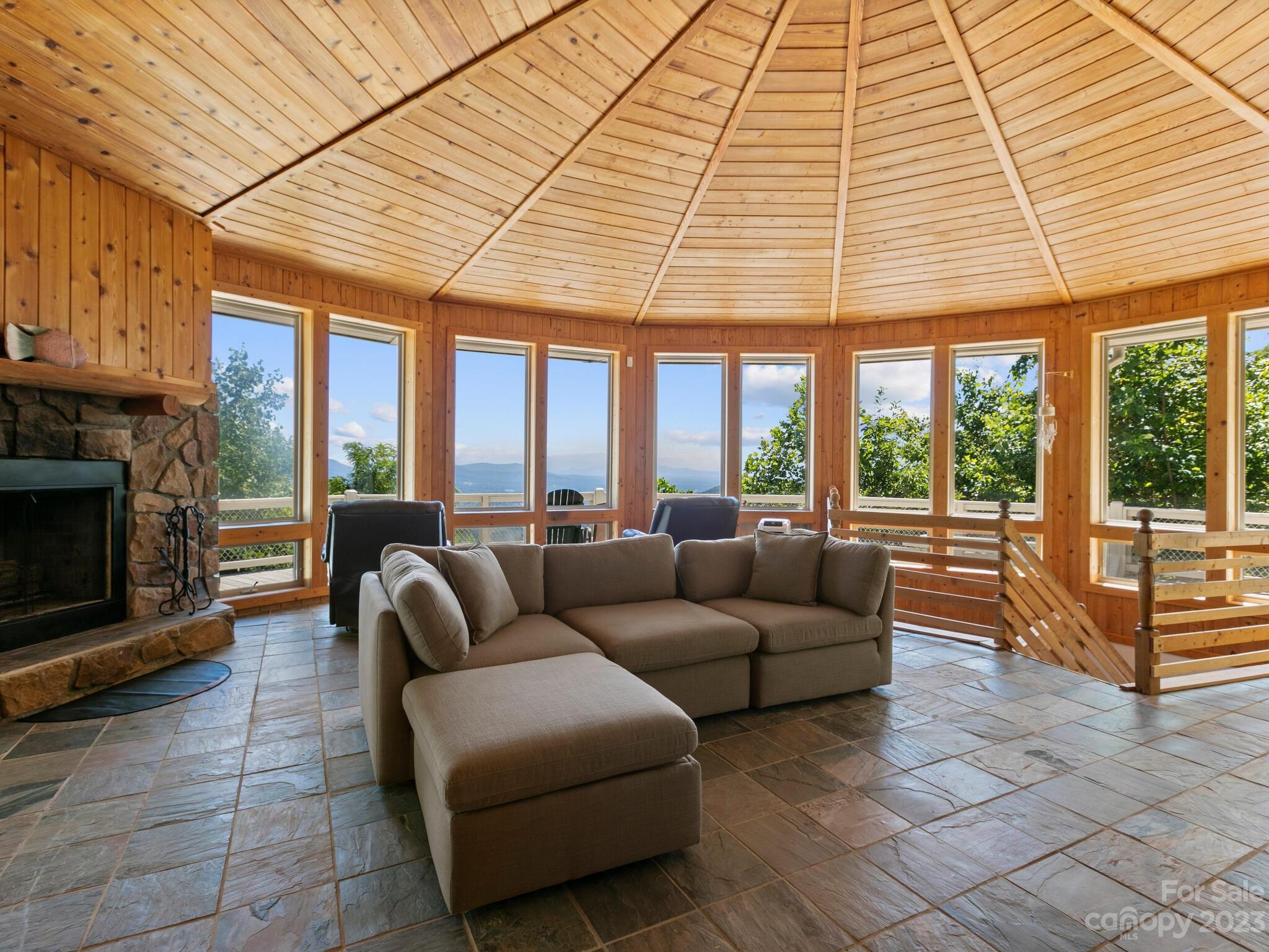 39 Rising Sun Road Candler, NC 28715 - Photo 3 of 41 a living room with furniture and a fireplace