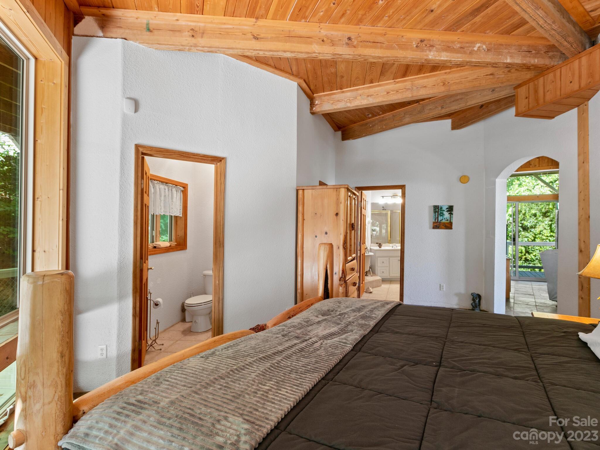 39 Rising Sun Road Candler, NC 28715 - Photo 31 of 41 a bedroom with a bed and a dresser