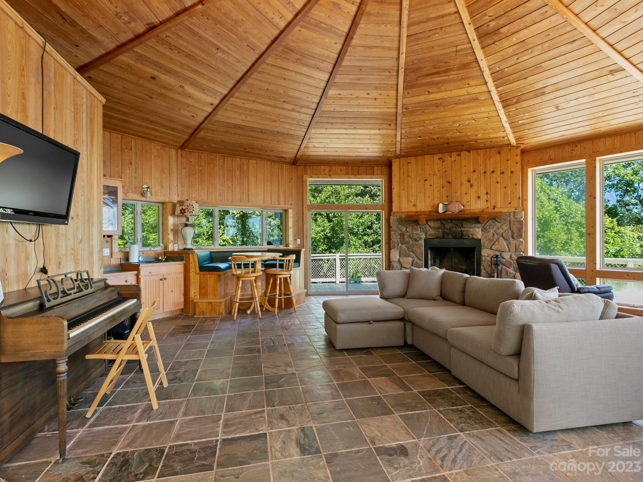 39 Rising Sun Road Candler, NC 28715 - Photo 34 of 41 a living room with patio furniture and a flat screen tv