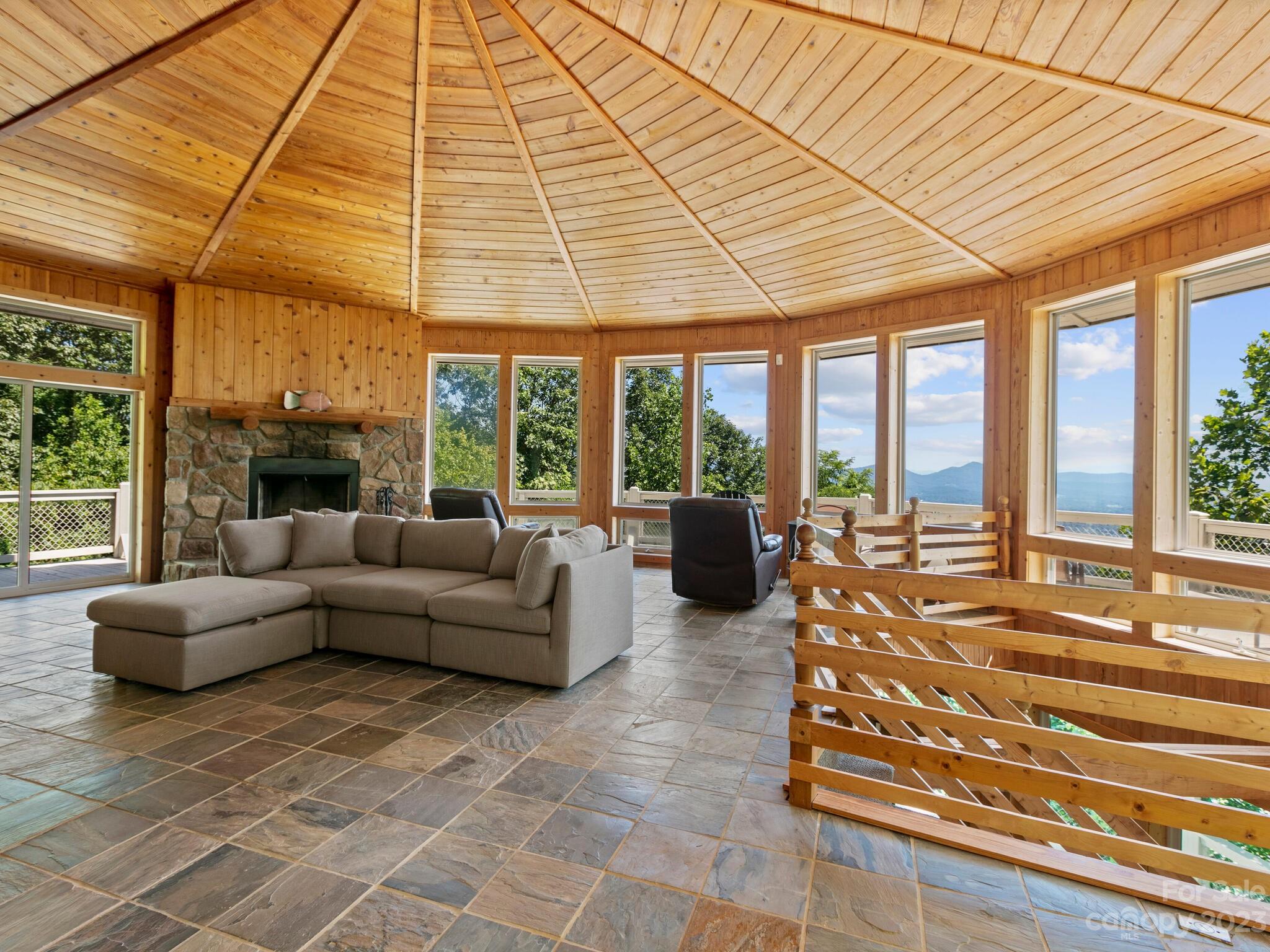 39 Rising Sun Road Candler, NC 28715 - Photo 35 of 41 a living room with furniture and a black umbrella