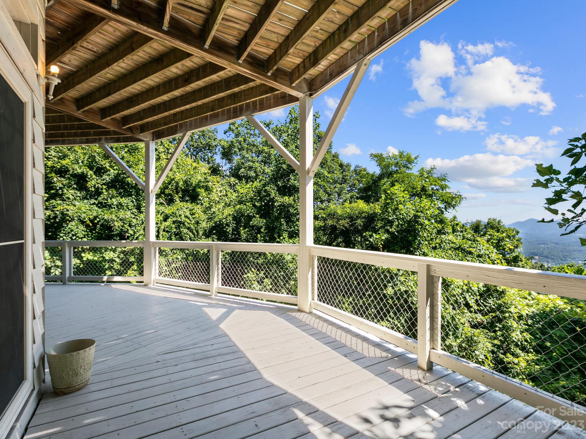 39 Rising Sun Road Candler, NC 28715 - Photo 4 of 41 a porch with seating space and garden view