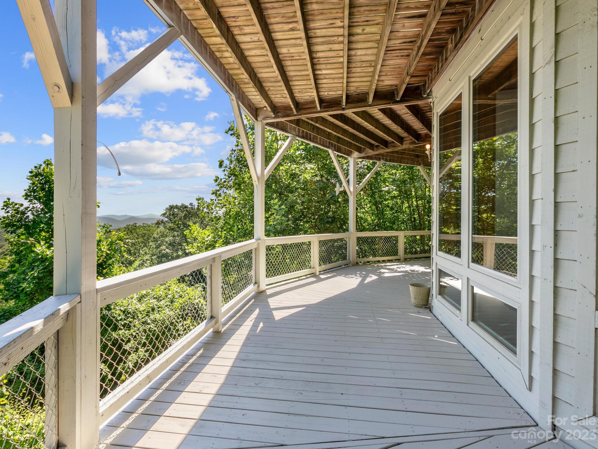 39 Rising Sun Road Candler, NC 28715 - Photo 5 of 41 a view of a balcony with wooden floor