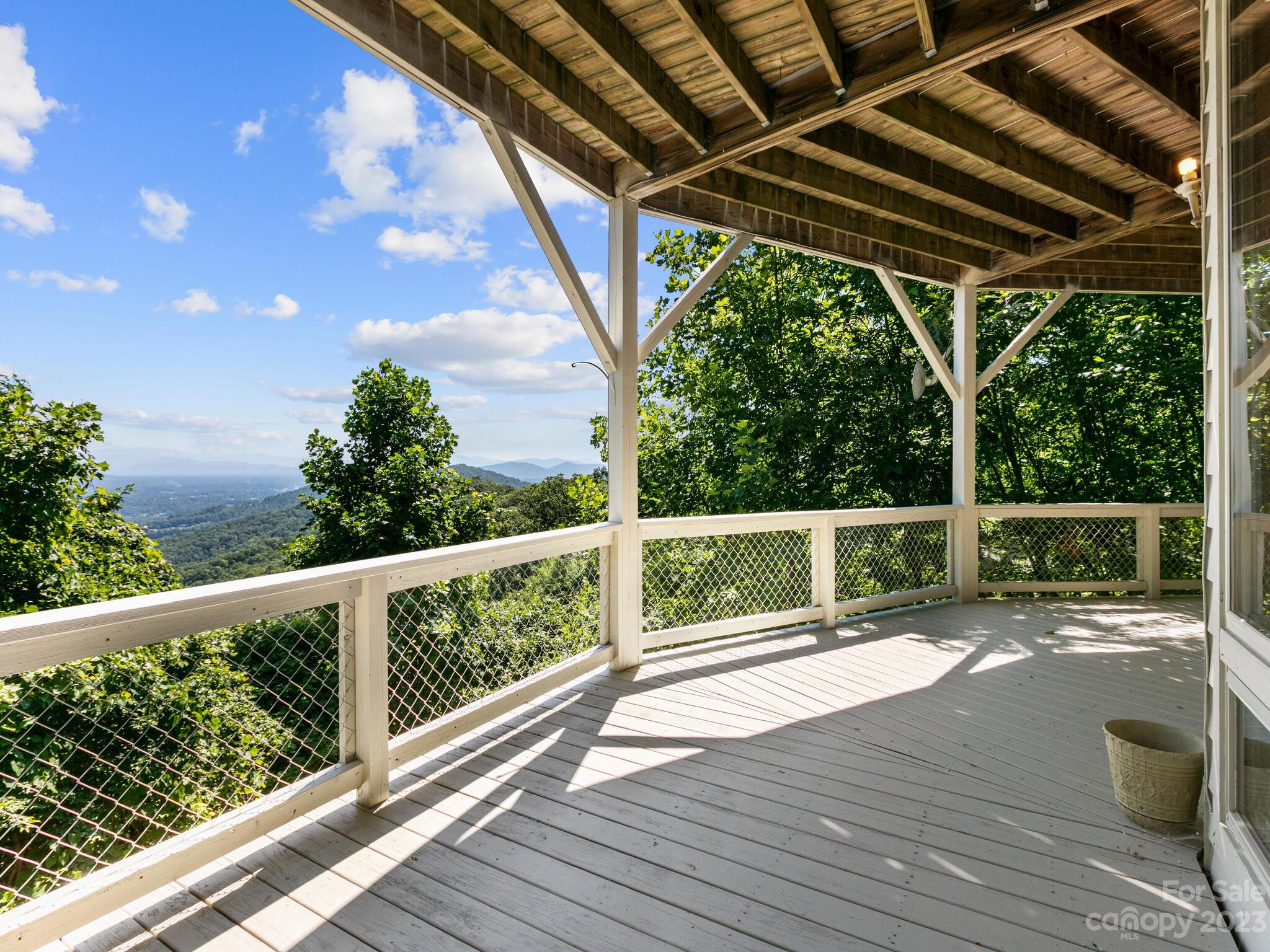 39 Rising Sun Road Candler, NC 28715 - Photo 6 of 41 a view of a porch with wooden floor