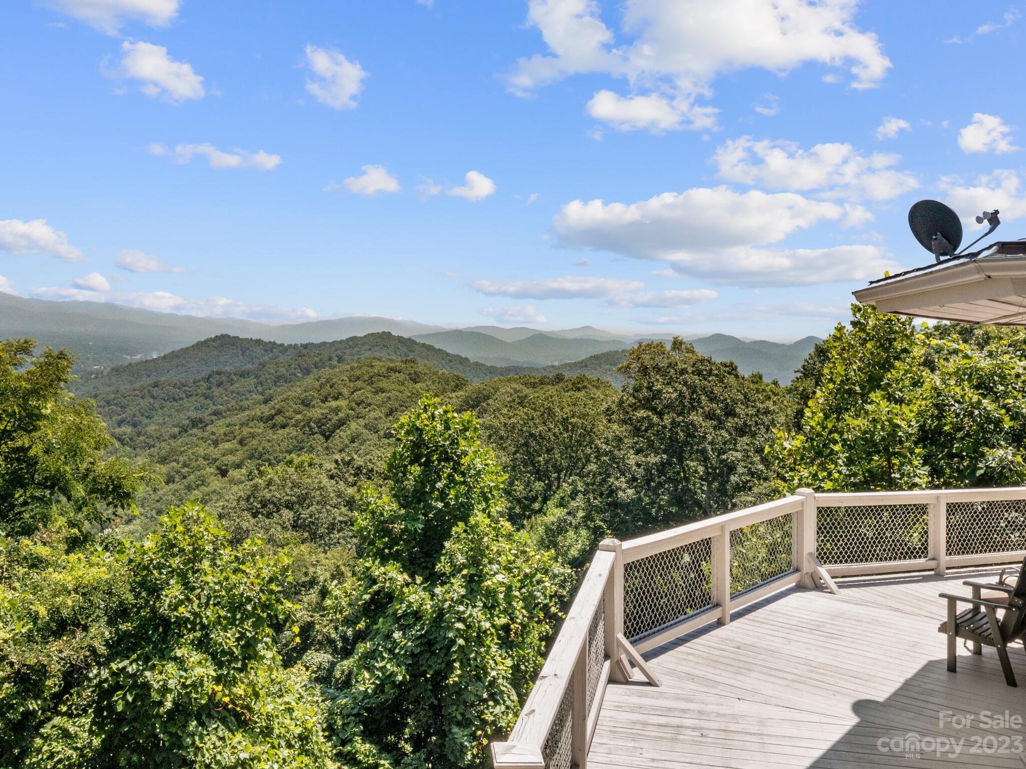39 Rising Sun Road Candler, NC 28715 - Photo 9 of 41 a view of a balcony with chairs