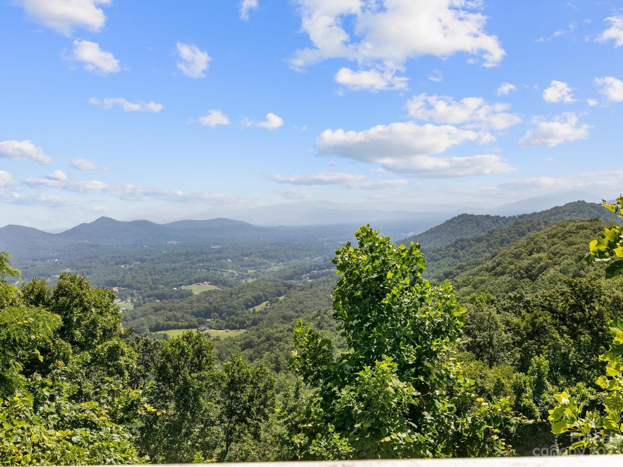 39 Rising Sun Road Candler, NC 28715 - Photo 10 of 41 a view of a city with lush green forest
