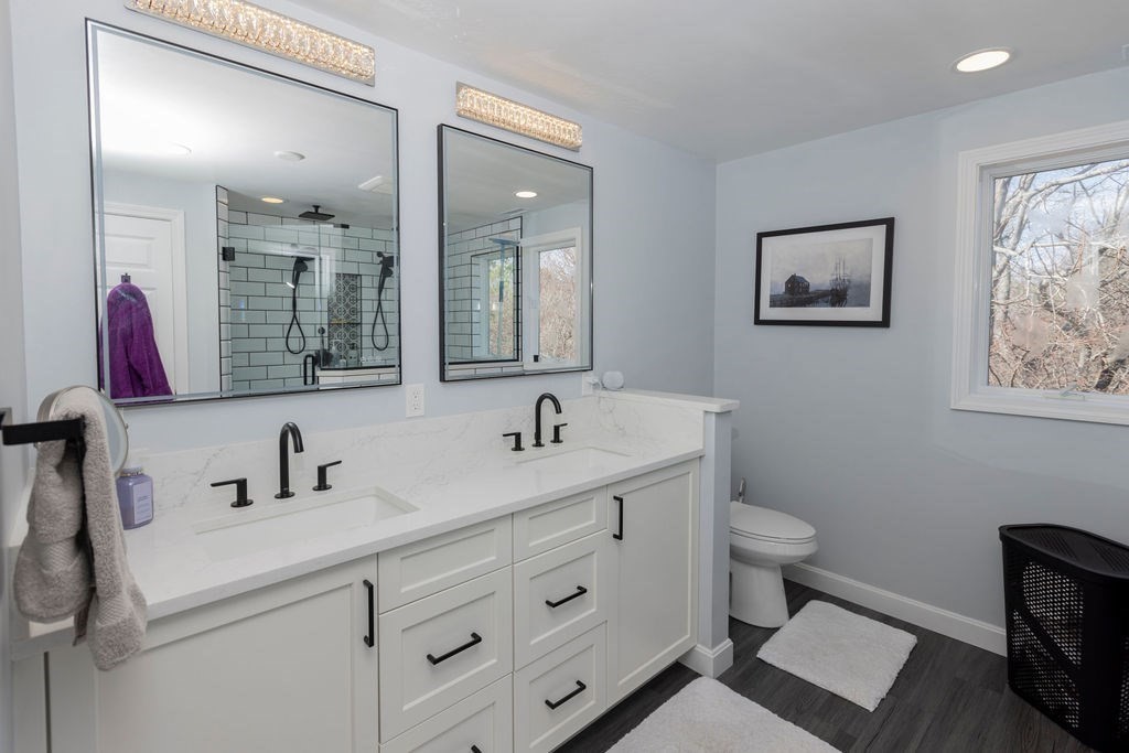 126 Lafayette Street Marblehead, MA 01945 - Photo 17 of 30 a bathroom with a toilet sink and mirror