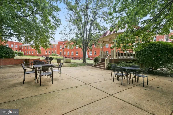 a view of table and chairs in a patio