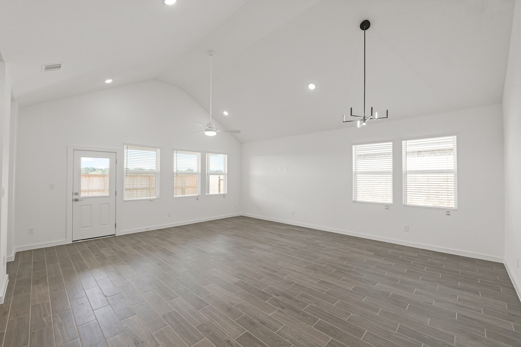 7807 Jasper Mdws Way Angleton, TX 77515 - Photo 8 of 26 Open great room and dining area (*Photo not of actual home and used for illustration purposes only.)