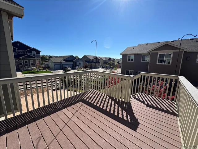 a view of balcony with wooden floor