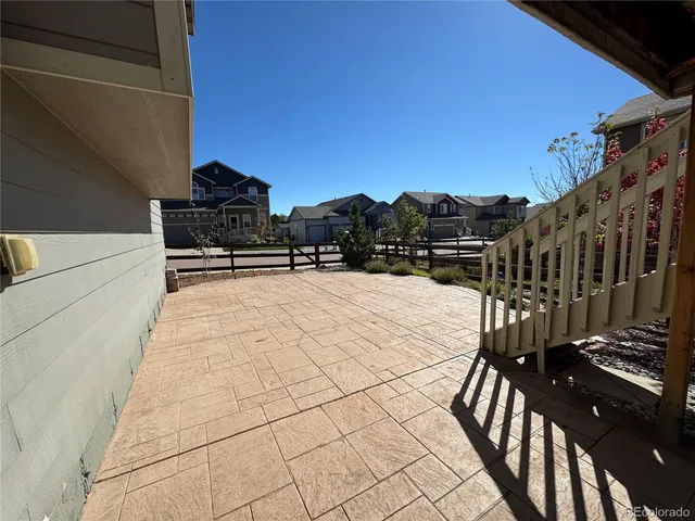 a view of balcony with wooden floor